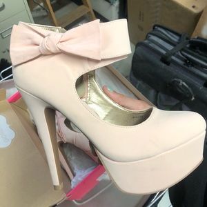 Blush pink platform pumps